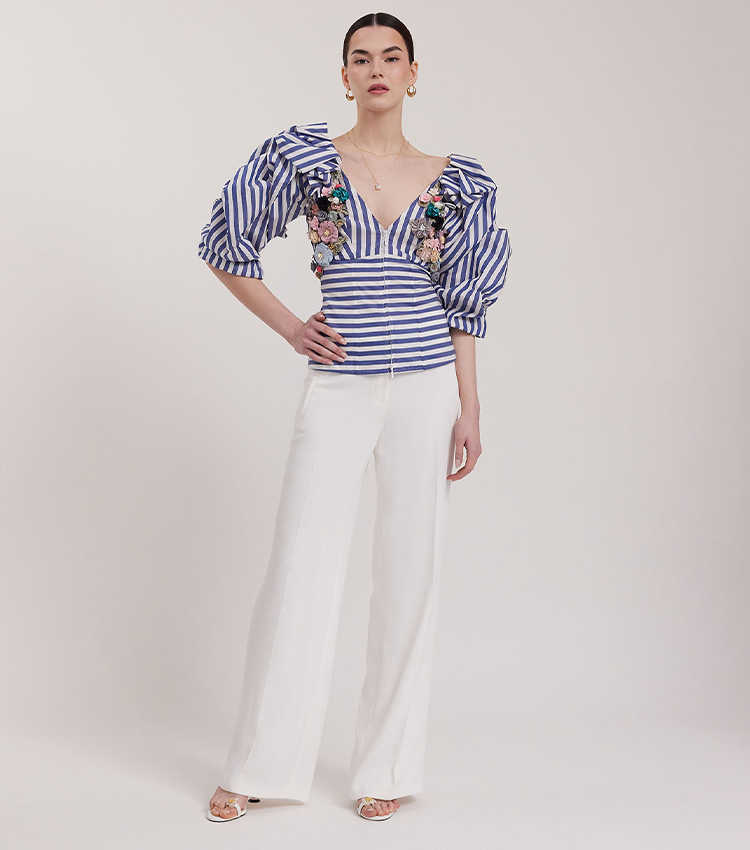 Discover the Tulipe Blue & White Striped Blouse With Exaggerated Sleeves & 3D Colorful Floral Applique & Corset Back from designer Anne Fontaine