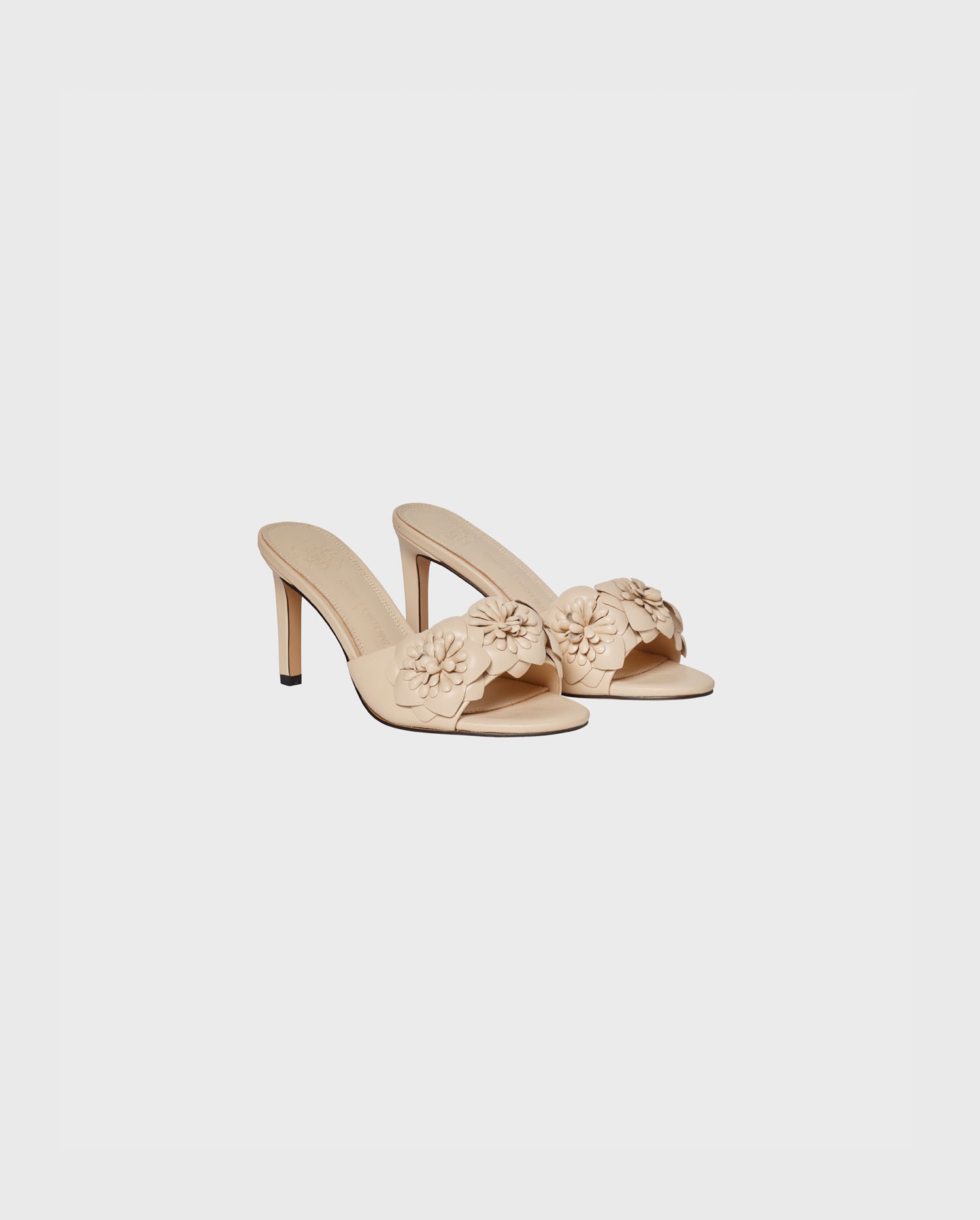 Shop the neutral color leather sandal heels with intricate floral detailing from ANNE FONTAINE