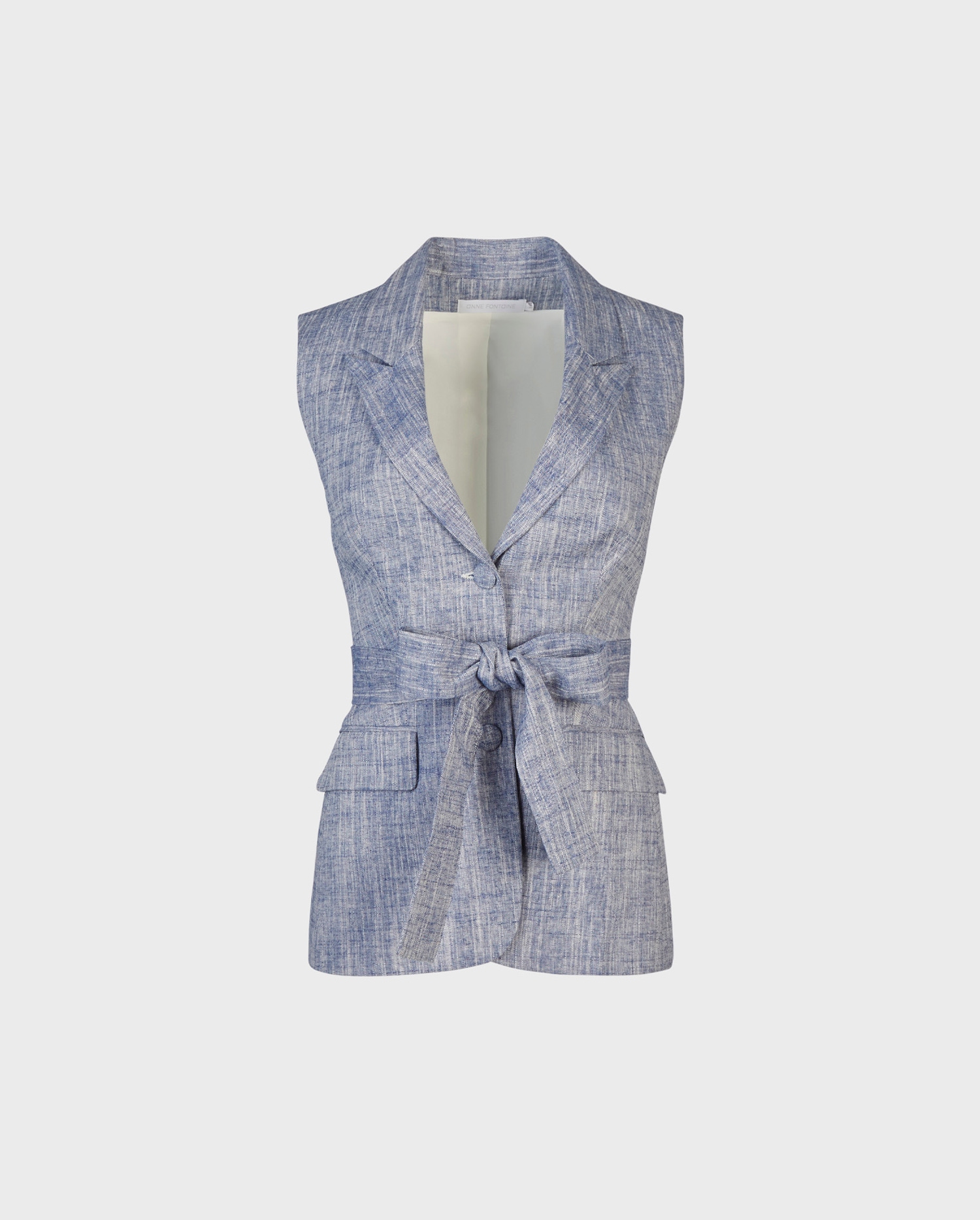 Explore the blue chambray sleeveless linen vest with single button closure and enhanced with optional fabric belt