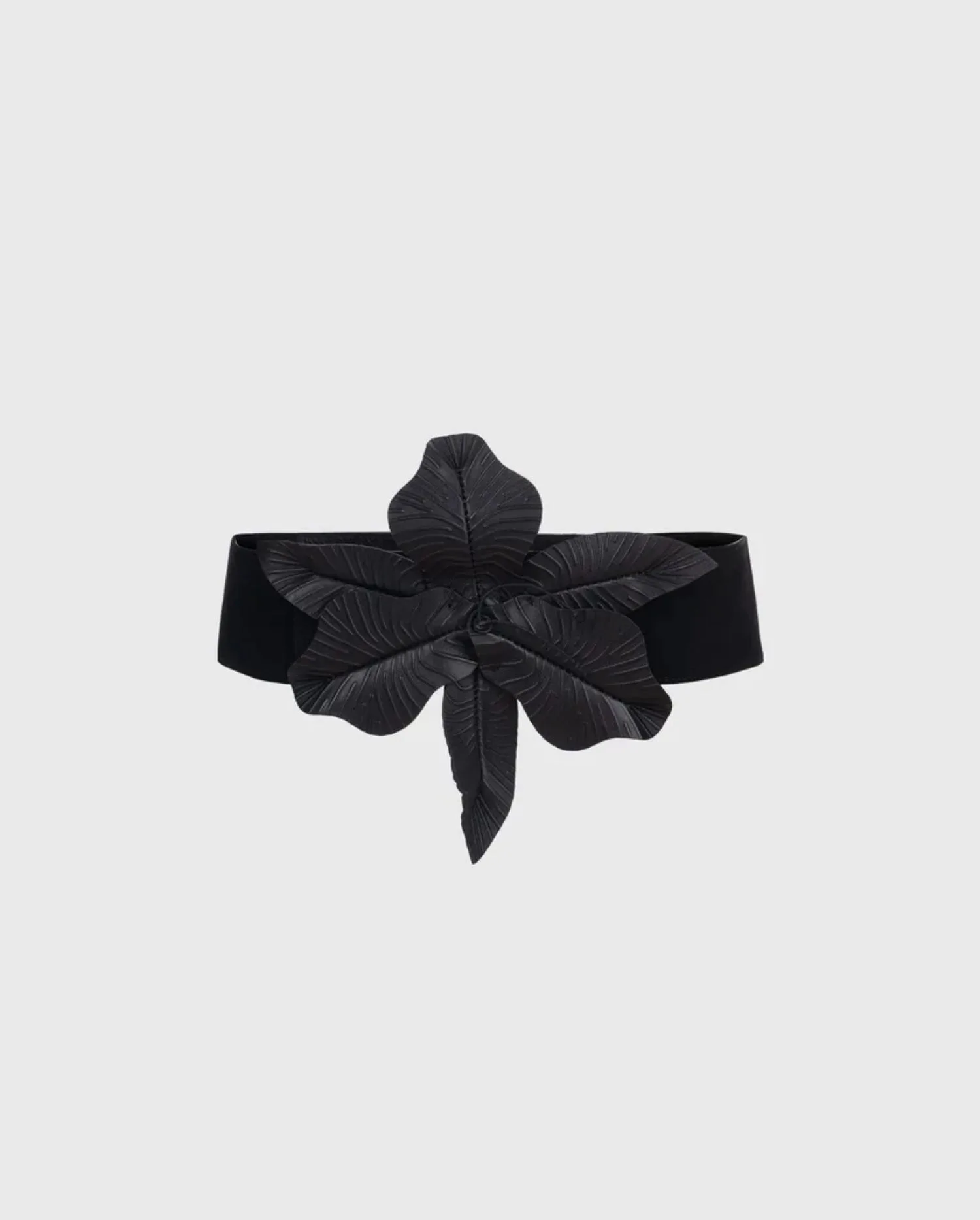 Discover the CARRIE Black Wide Leather Belt With an Oversized Flower by designer ANNE FONTAINE