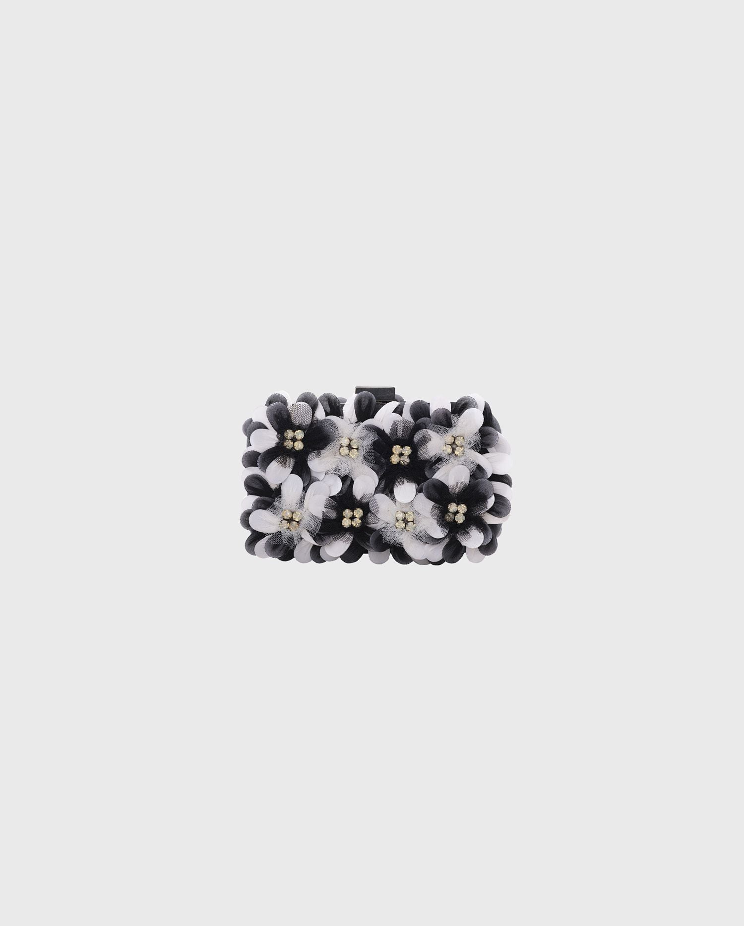 The FAUVE floral black and white box clutch is the perfect style to add to your look