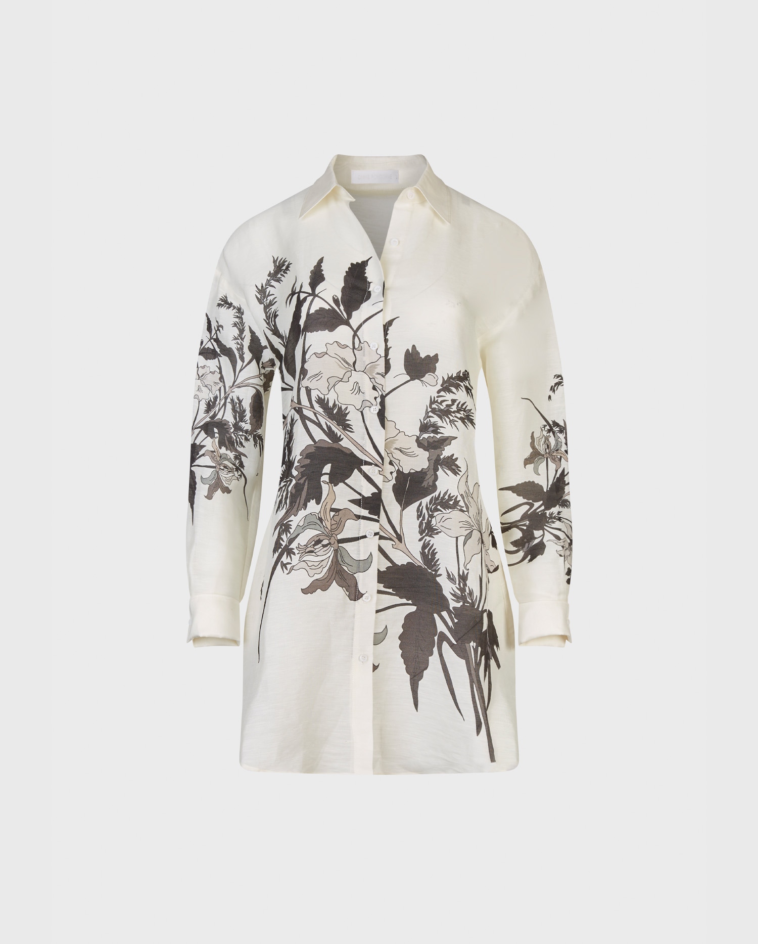Explore the new FELISA off white long sleeve oversized white shirt with black floral design