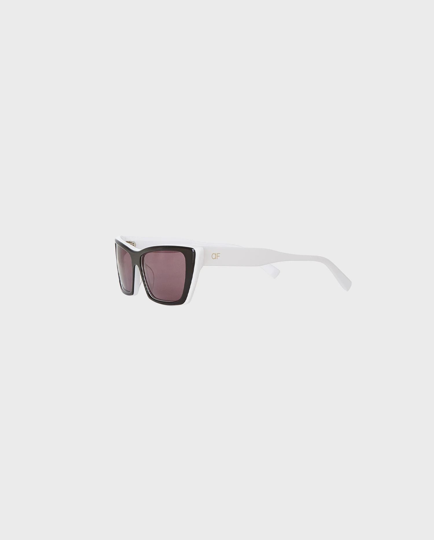 Discover the Hera Black and White Retro Cat Eye Sunglasses from designer ANNE FONTAINE