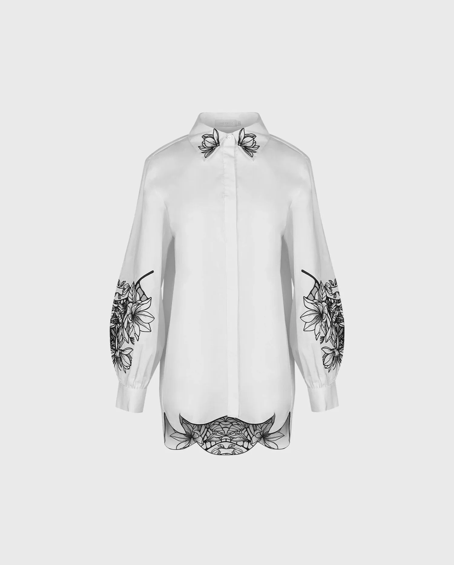 Discover the Leonie White Long Sleeve Cotton Poplin Shirt With Black Embroidered Flowers from designer ANNE FONTAINE