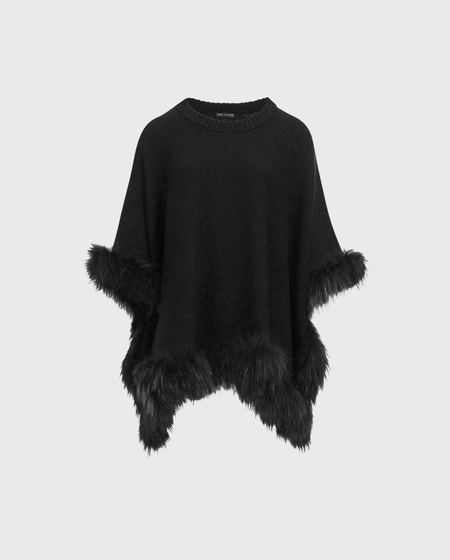 Shop the LOIC knitted poncho with fur trim in black from ANNE FONTAINE