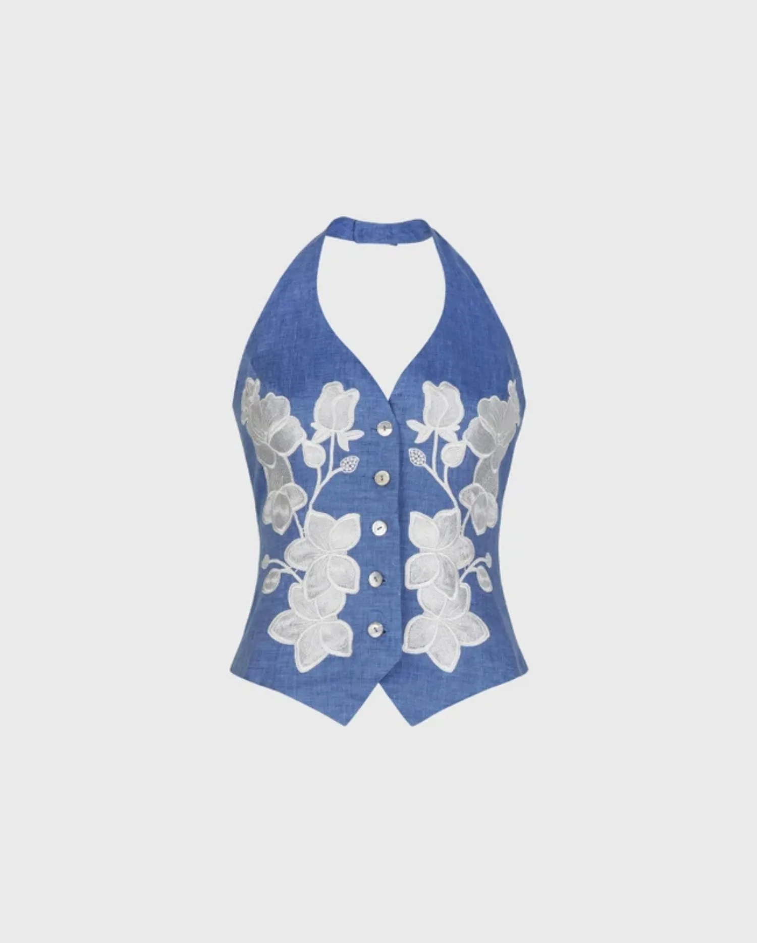 Discover the IONA Chambray Blue Linen Vest With Floral Embroidery And Pearl Button Detailing by designer ANNE FONTAINE