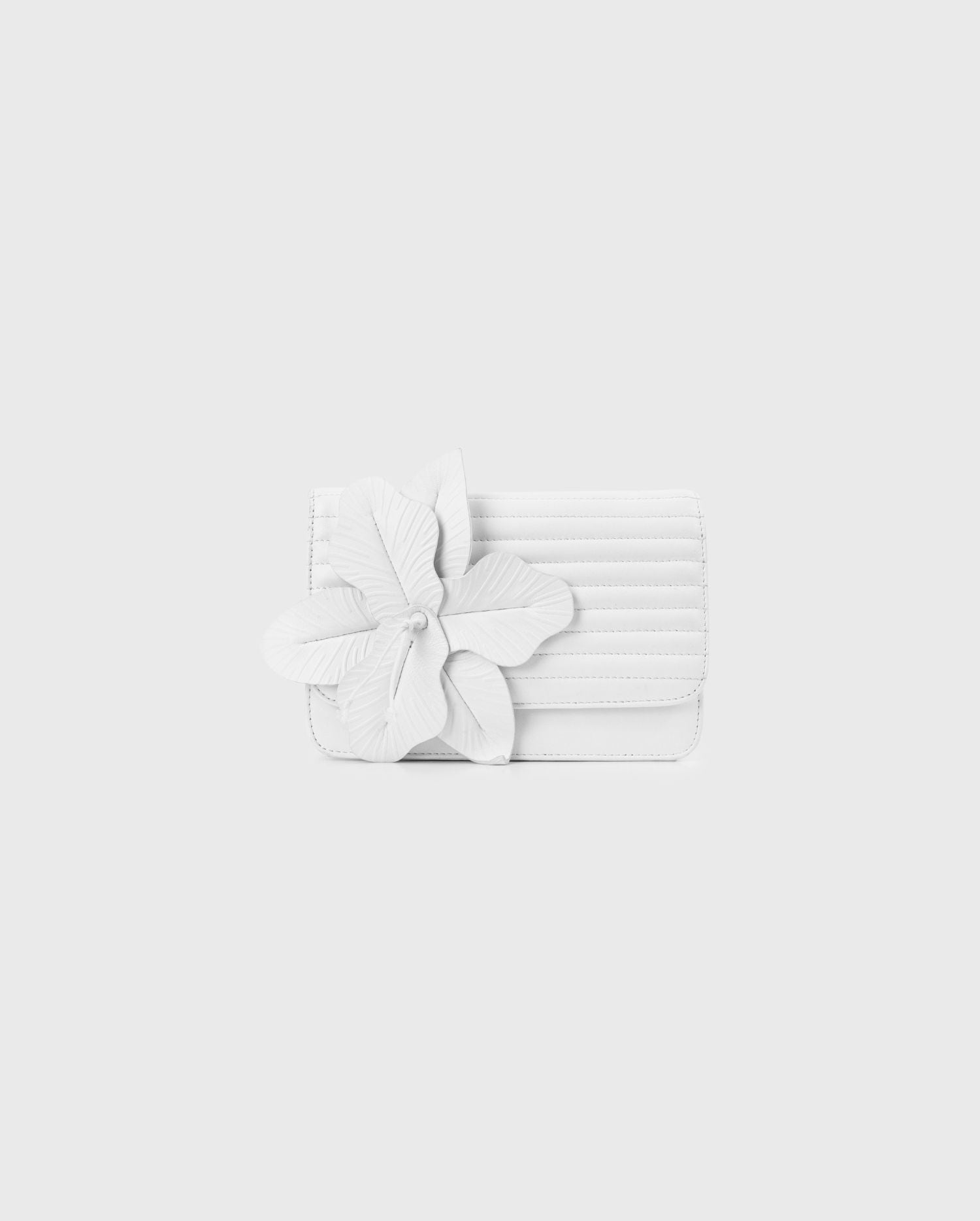 Shop the White Nicki Leather Handbag With a Large Flower from designer Anne Fontaine