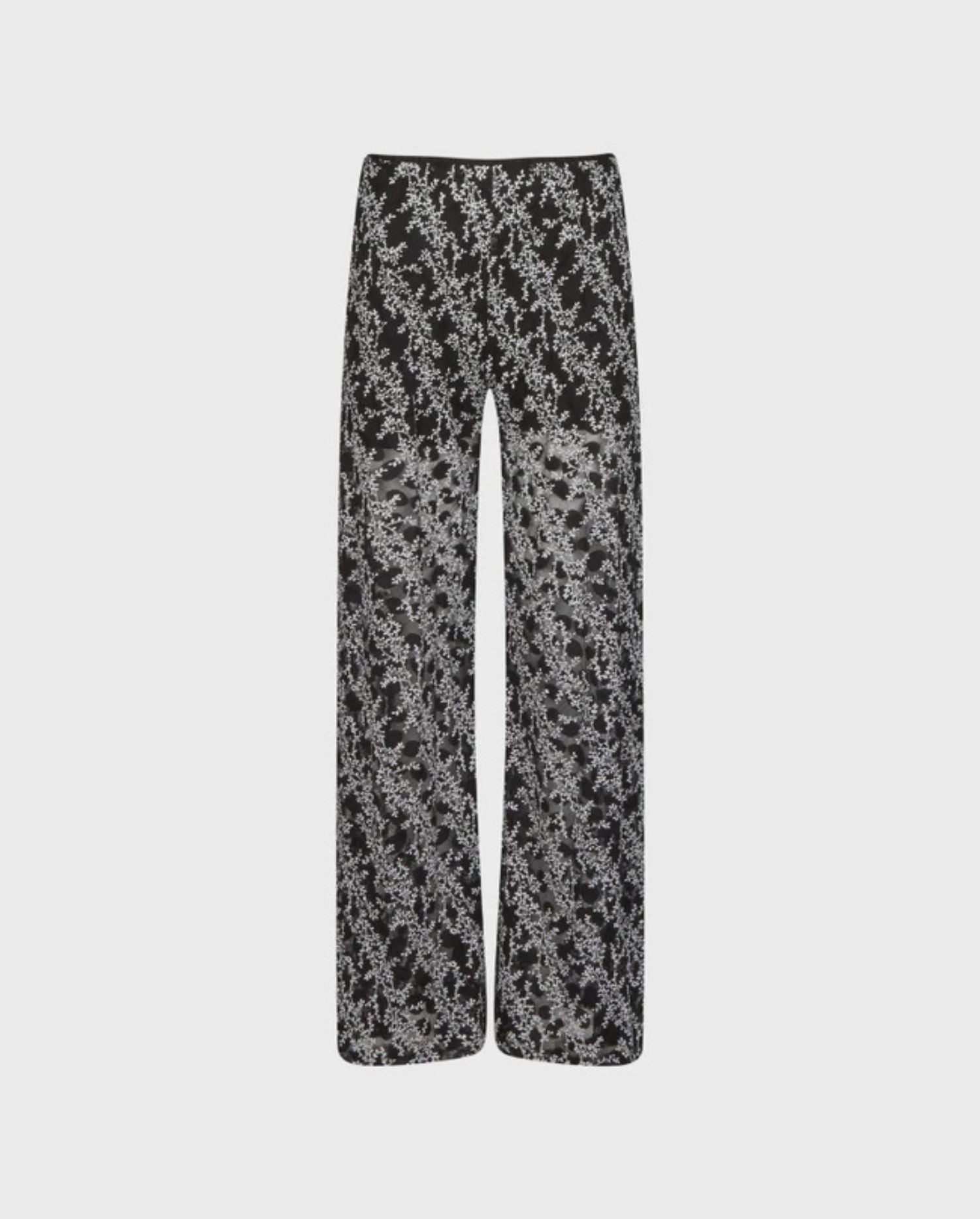 DIscover the MALIKA Black Wide Leg Sheer Pants With White Floral Applique Design by designer ANNE FONTAINE